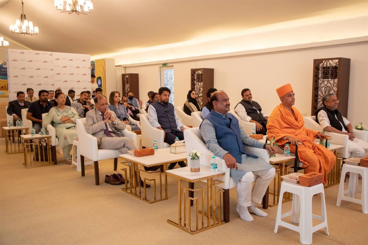 The senior delegation attends a presentation on the BAPS Hindu Mandir master plan and history