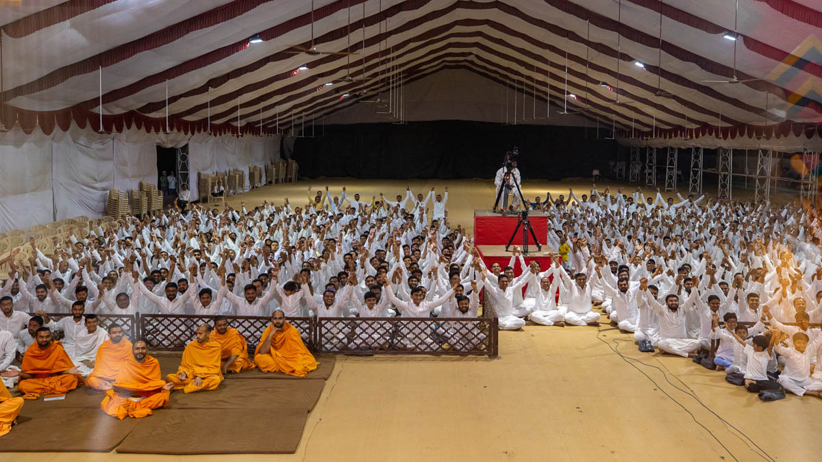 Devotees join hands in a gesture of unity