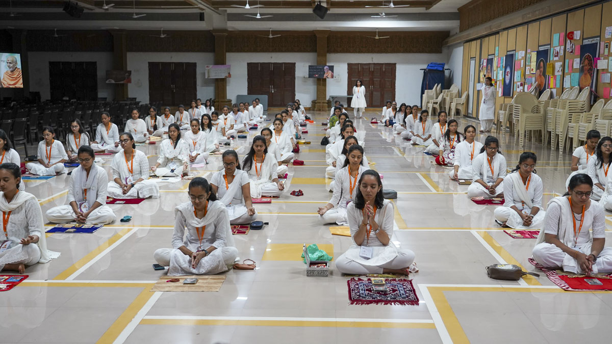Students perform their daily puja
