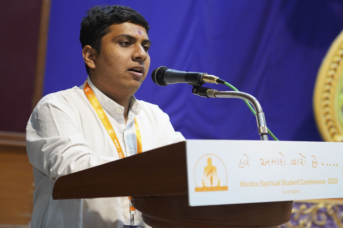 A student addresses the conference
