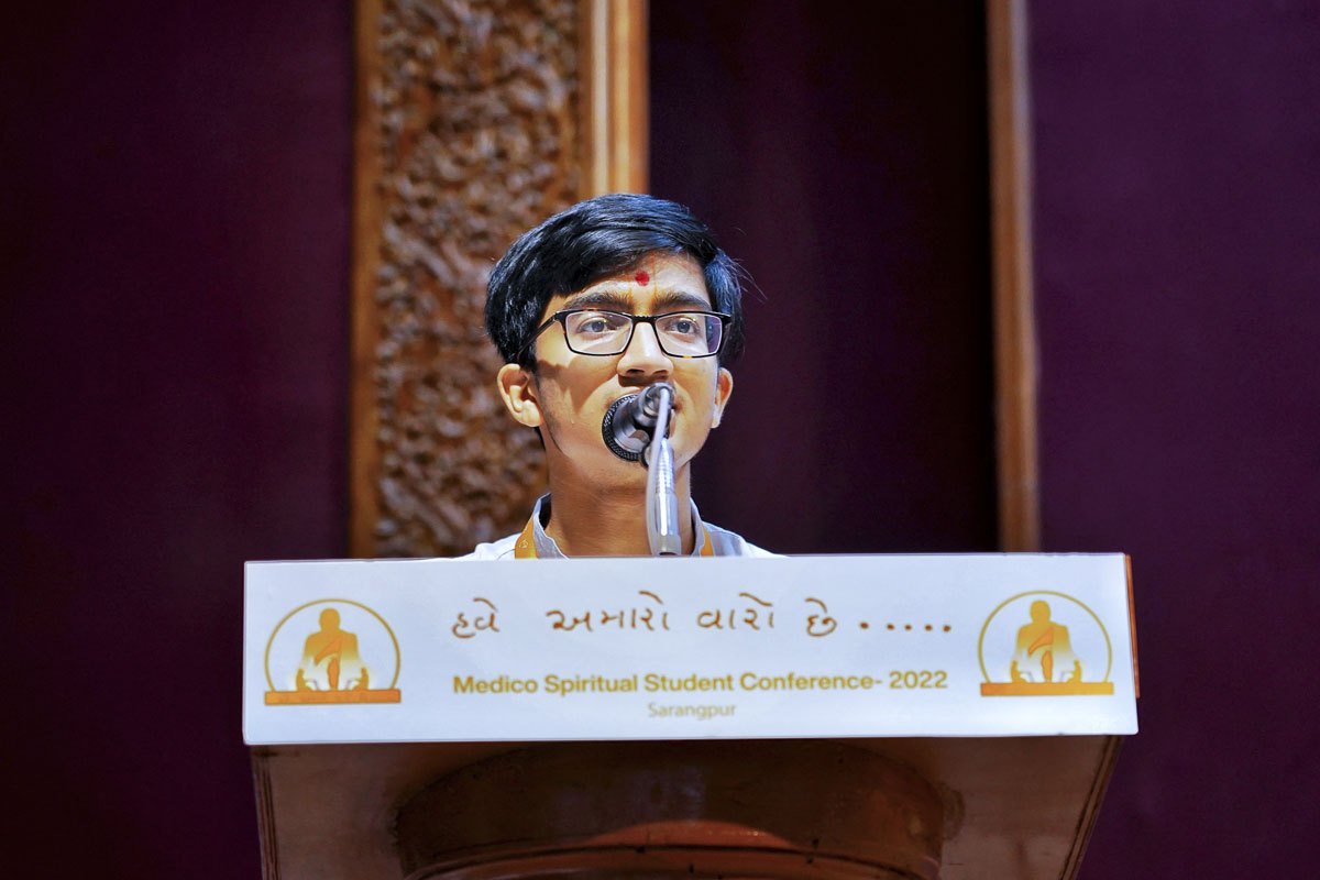A student addresses the conference
