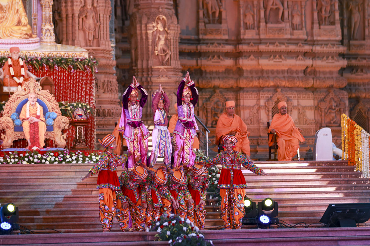 Children and youths perform a traditional dance