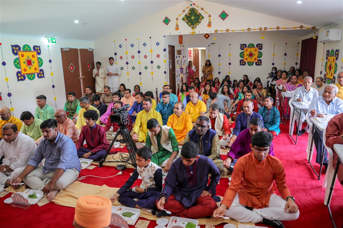 Devotees participate in the mahapuja rituals