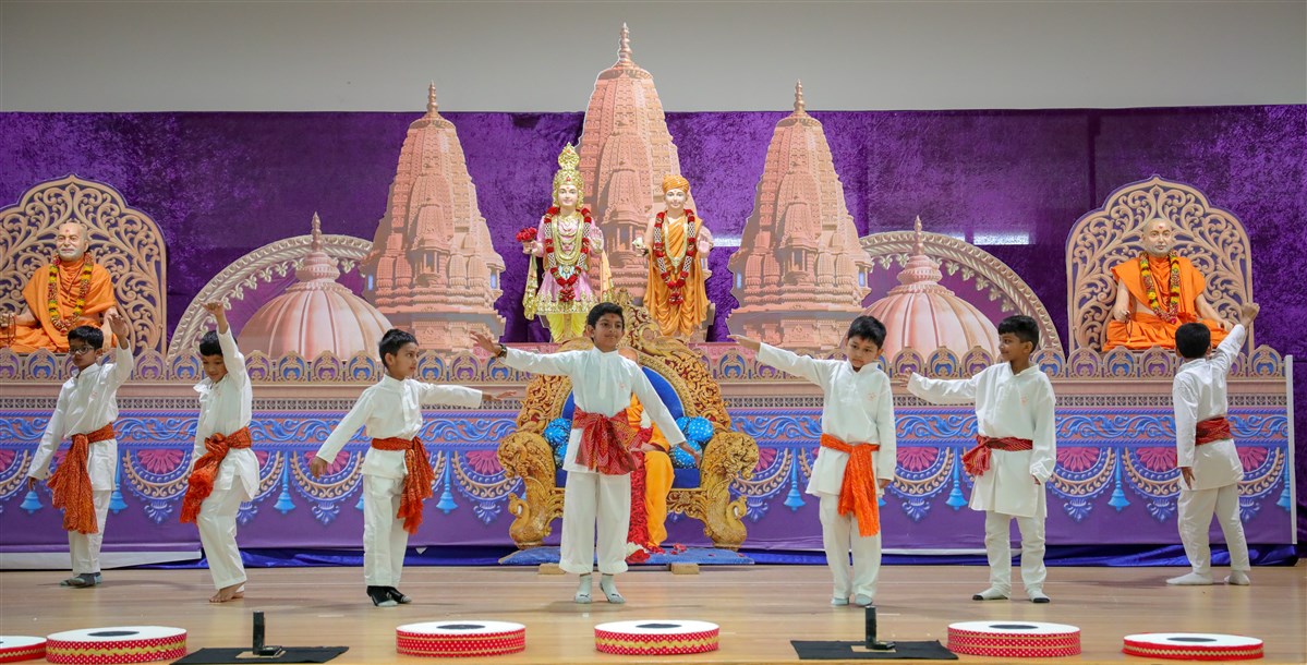 Children perform a celebratory dance