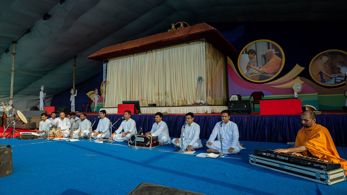 Youths sing kirtans in the evening Sunday satsang assembly