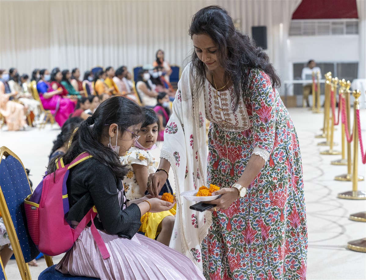 Devotees engaged in offering flowers
