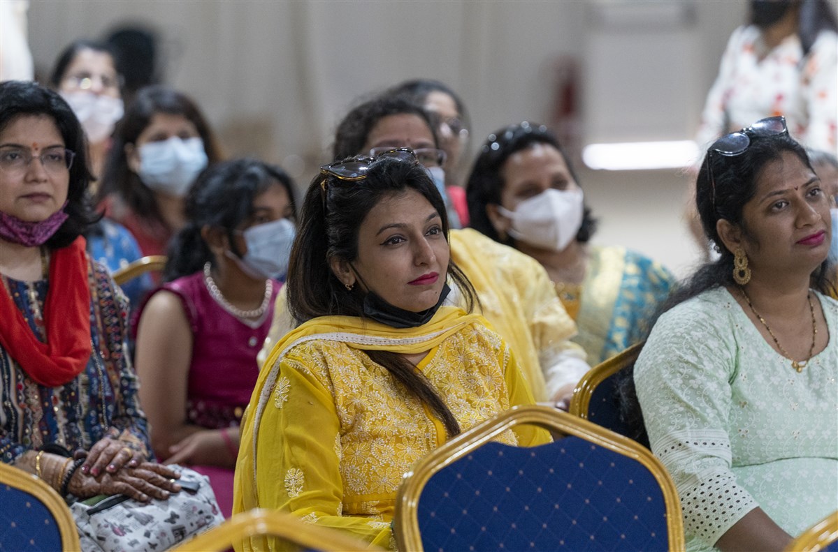 Devotees listening to discourse delivered in Marathi