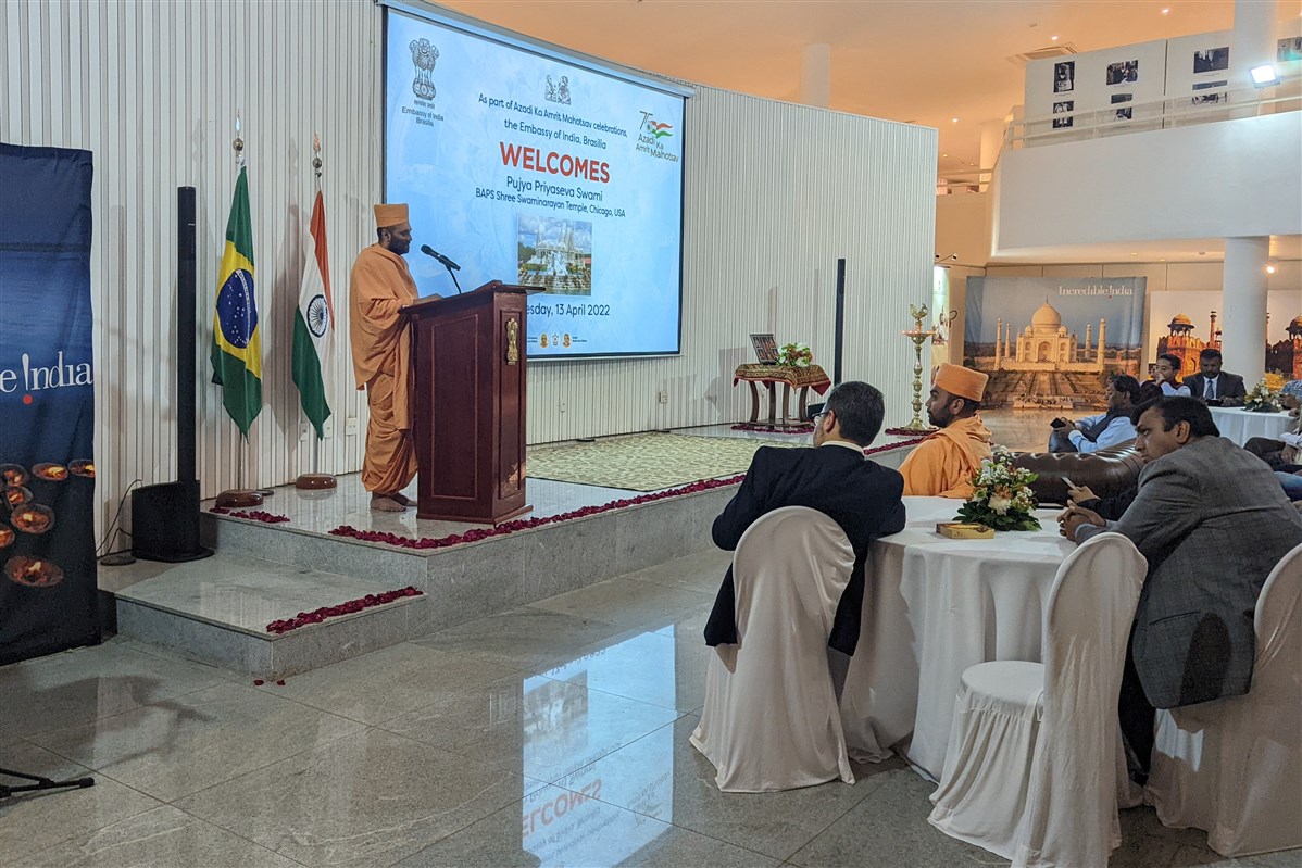 Pujya Priyasevadas Swami addressing the assembly at the Indian Embassy in Brasilia, Brazil
