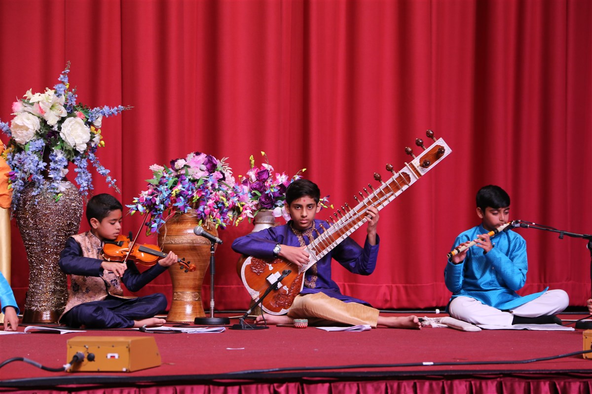 The devotional singing was accompanied by talented children playing the violin, sitar, flute and other musical instruments