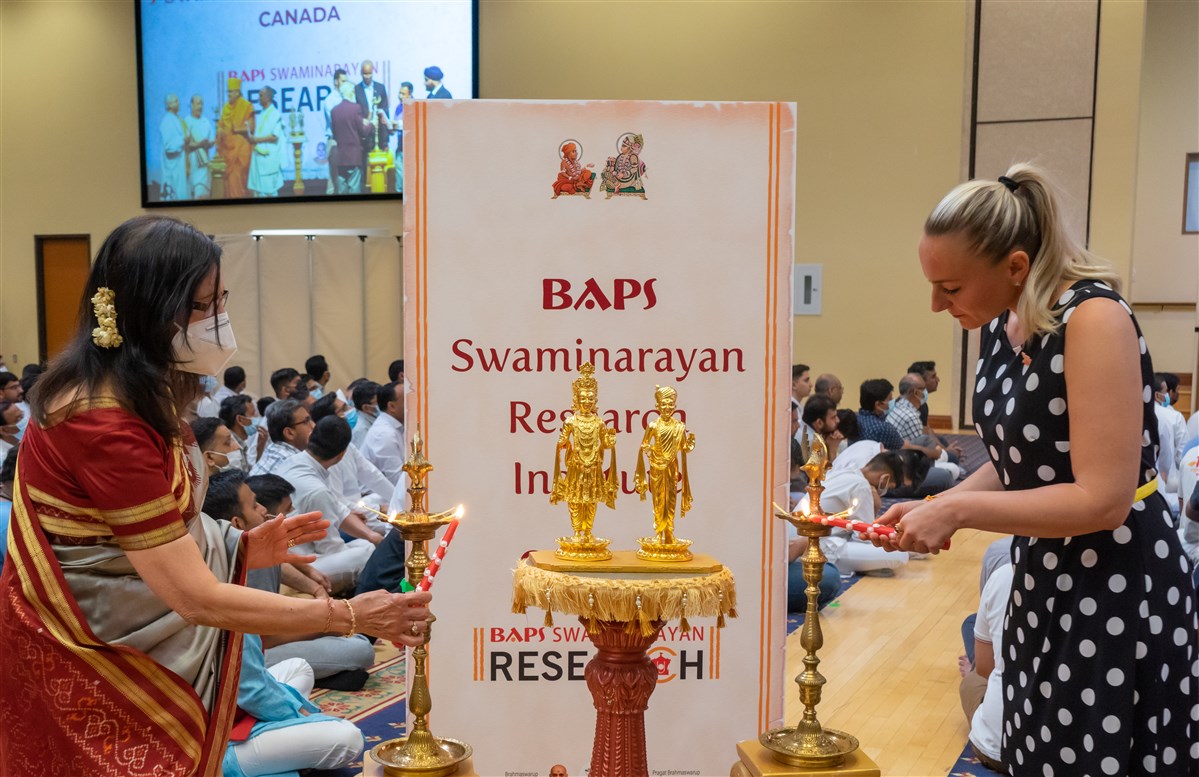 Guests ceremoniously light the lamps to mark the inauguration of the research institute