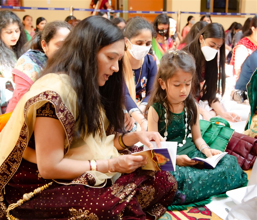 Devotees participate in the recital of 315 Sanskrit verses from the Satsang Diksha scripture