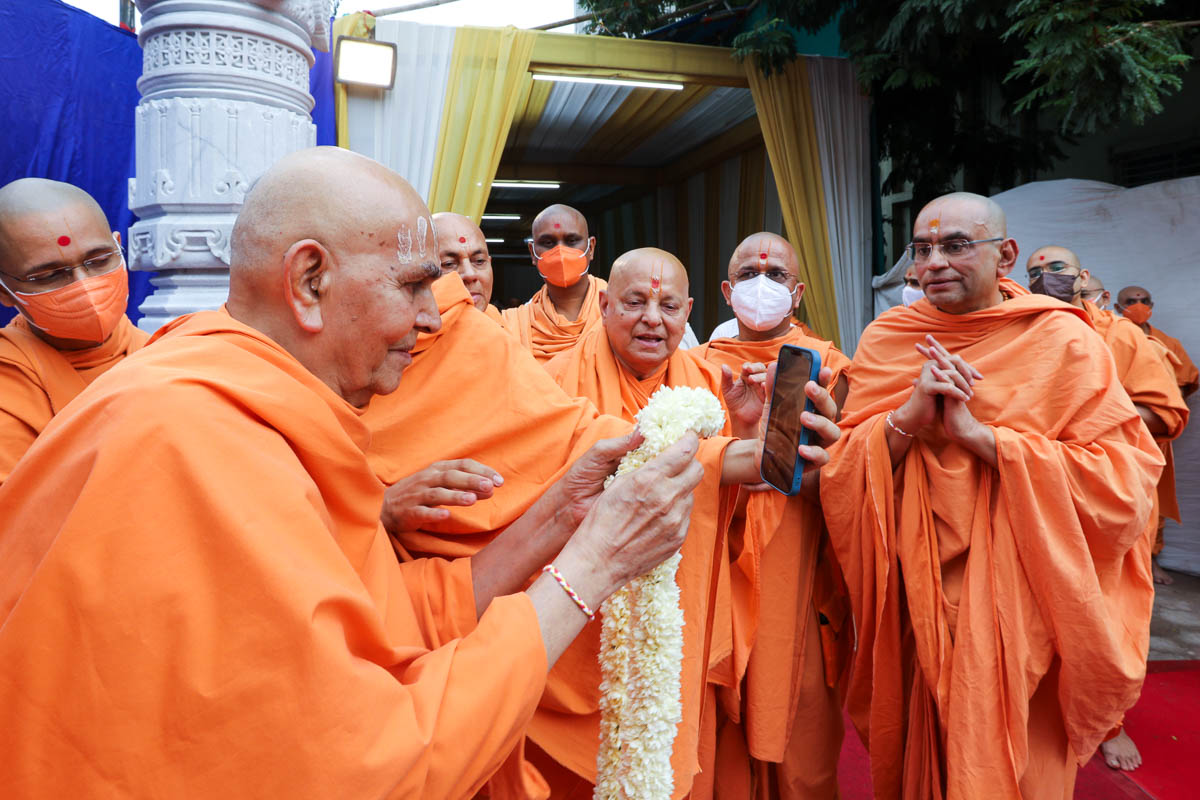 Swamishri blesses a devotee via video conference