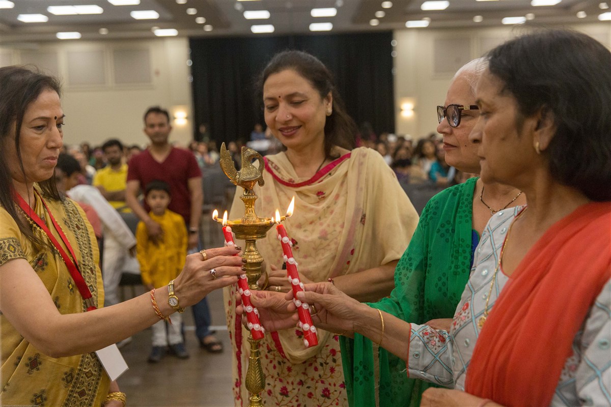 Guests ceremoniously light the lamps to mark the inauguration of the research institute