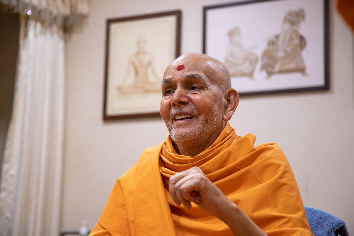 Swamishri in a conversation with sadhus
