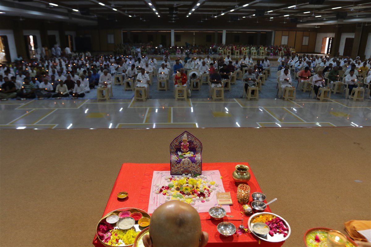 Devotees perform the arti
