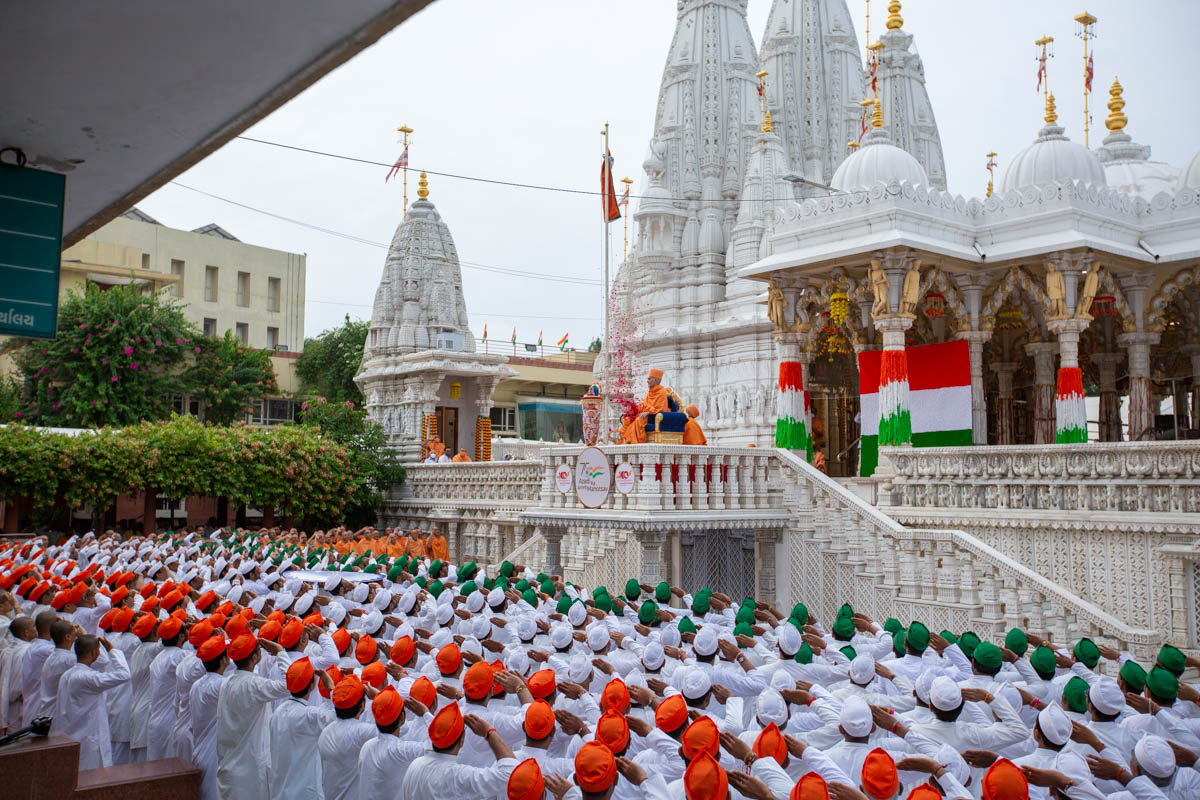 Sadhus and devotees during the flag hoisting ceremony
