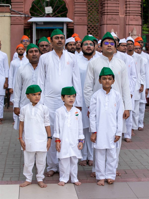 Devotees during the flag hoisting ceremony