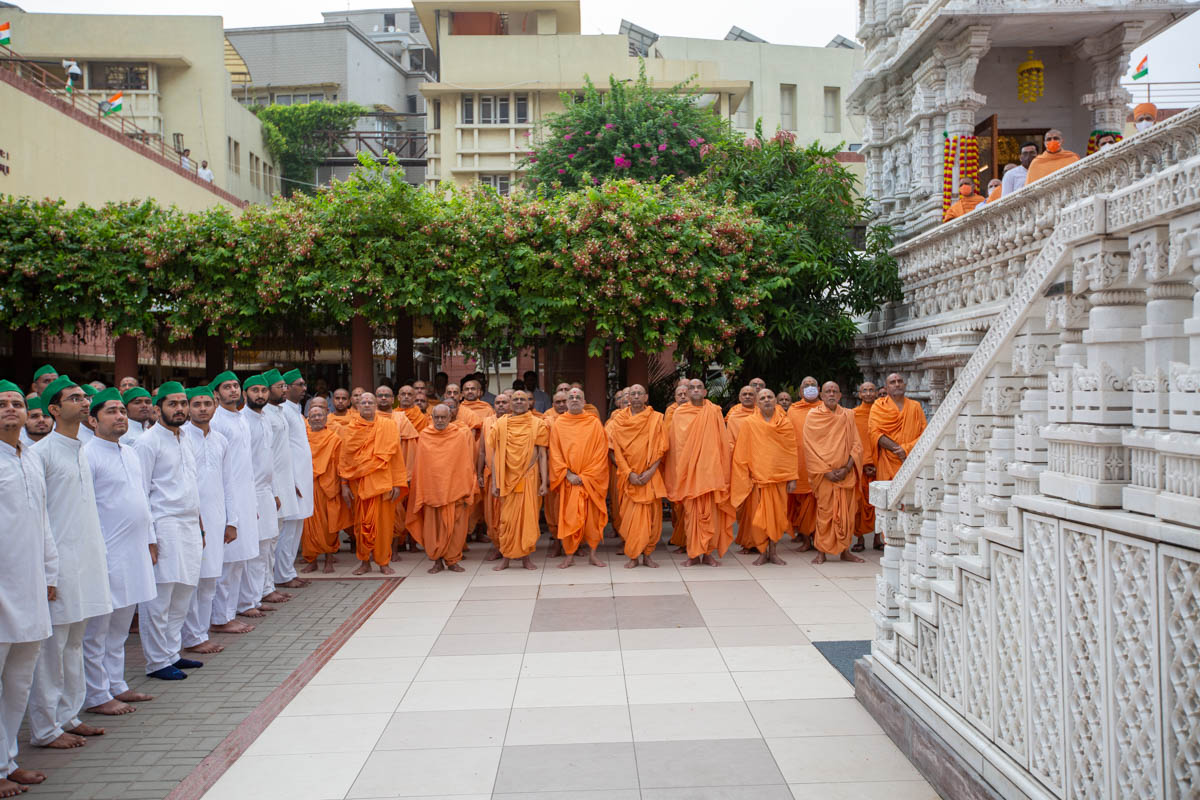 Sadhus and devotees during the flag hoisting ceremony