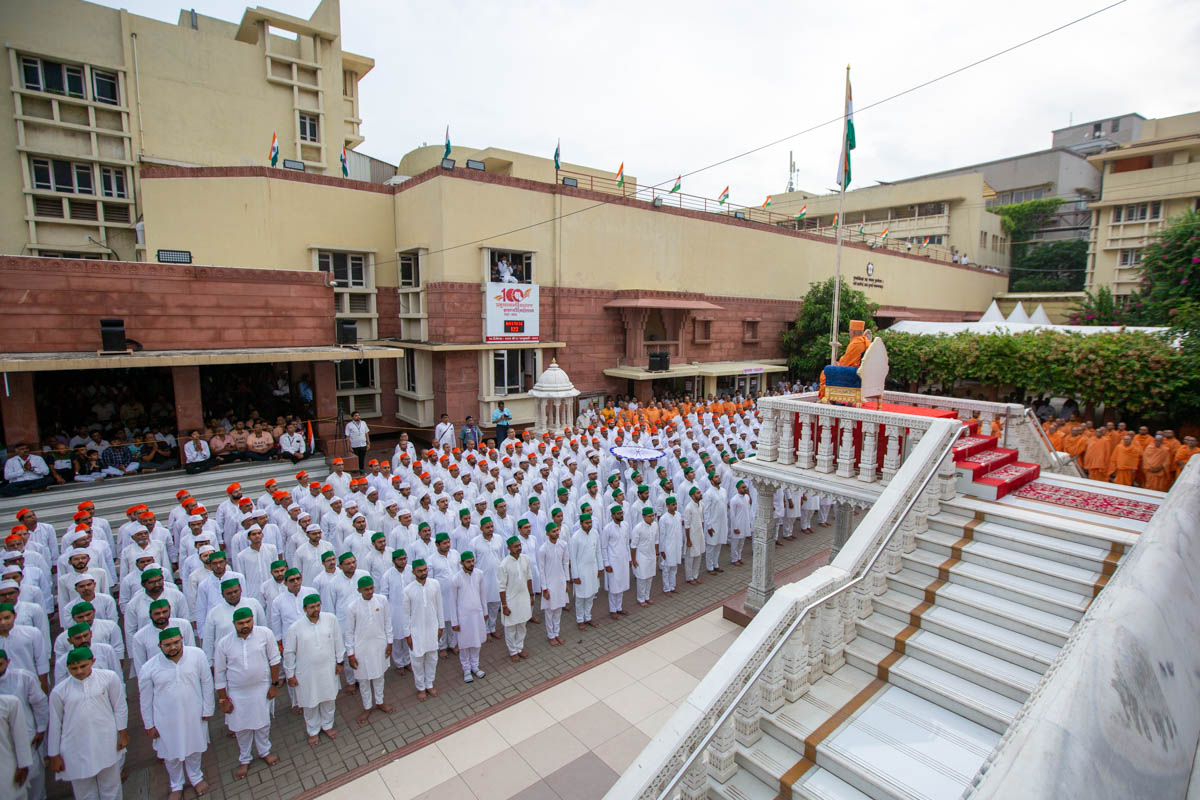 Sadhus and devotees during the flag hoisting ceremony