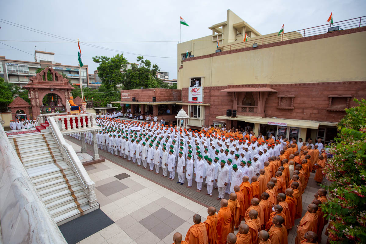 Sadhus and devotees during the flag hoisting ceremony