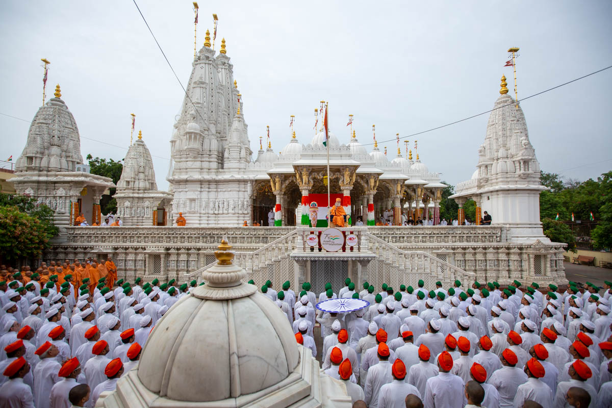 Sadhus and devotees during the flag hoisting ceremony