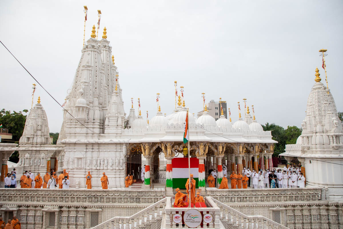Sadhus and devotees during the flag hoisting ceremony