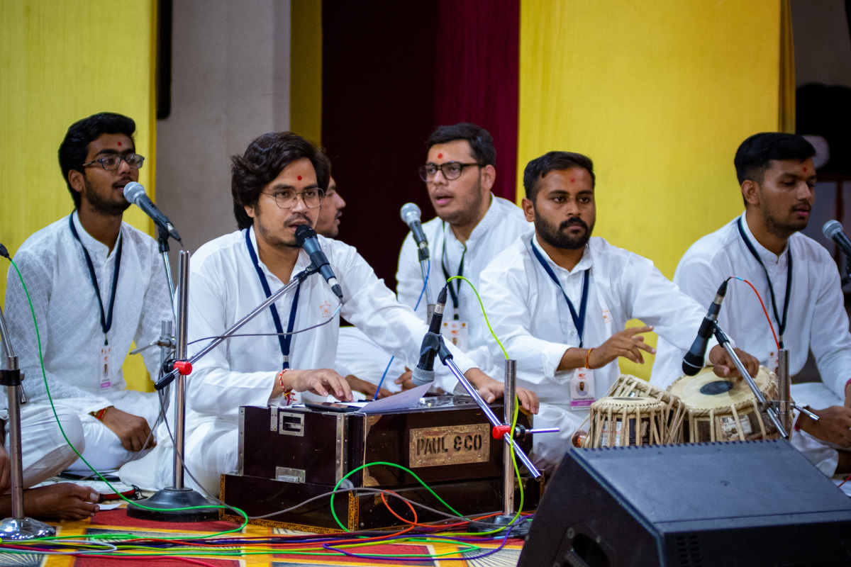 Youths sing kirtans in evening satsang assembly