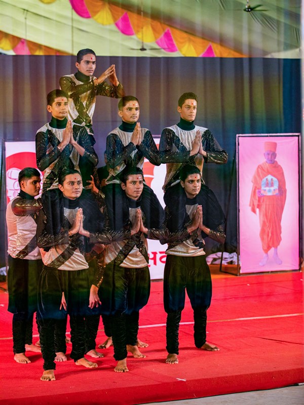 Youths performs a thematic dance