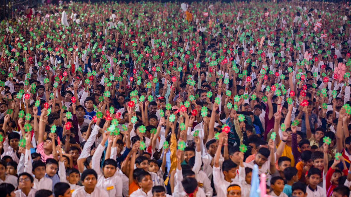 Children and devotees participate in an activity