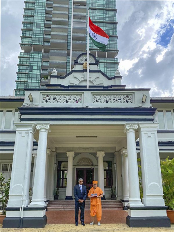 Pujya Ishwarcharan Swami and Shri P. Kumaran outside the embassy