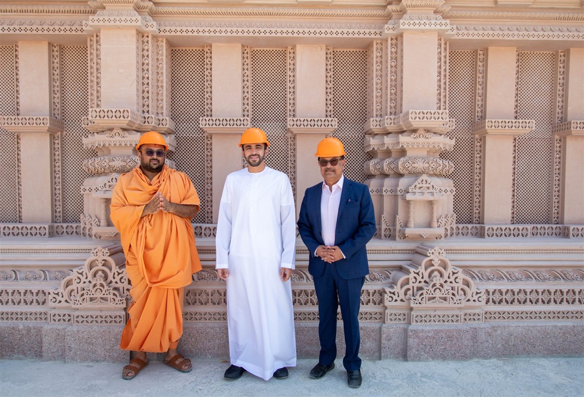 HE Abdul Nasser Alshaali poses in front of the intricately carved facade of the Mandir