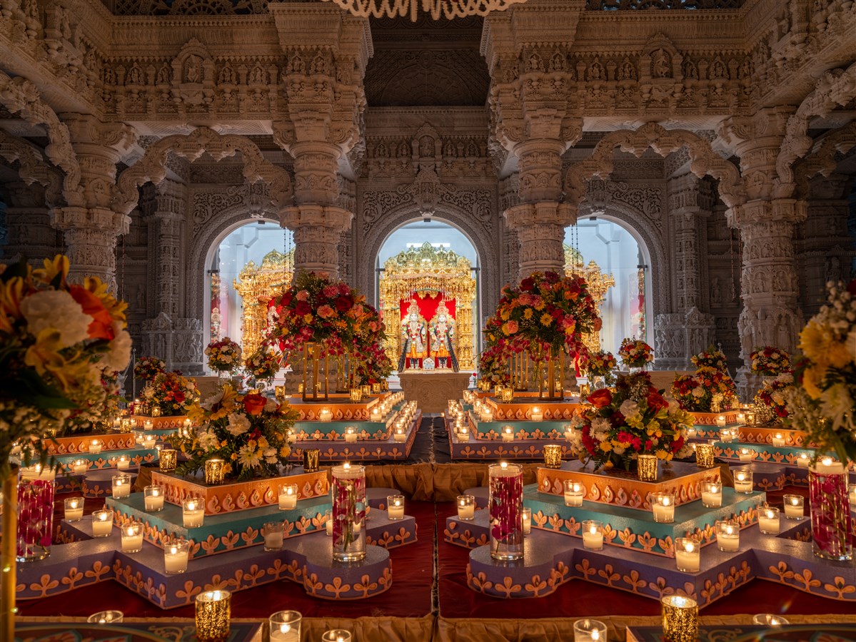 The glow of a traditional display of candles and lanterns inside the Mandir.