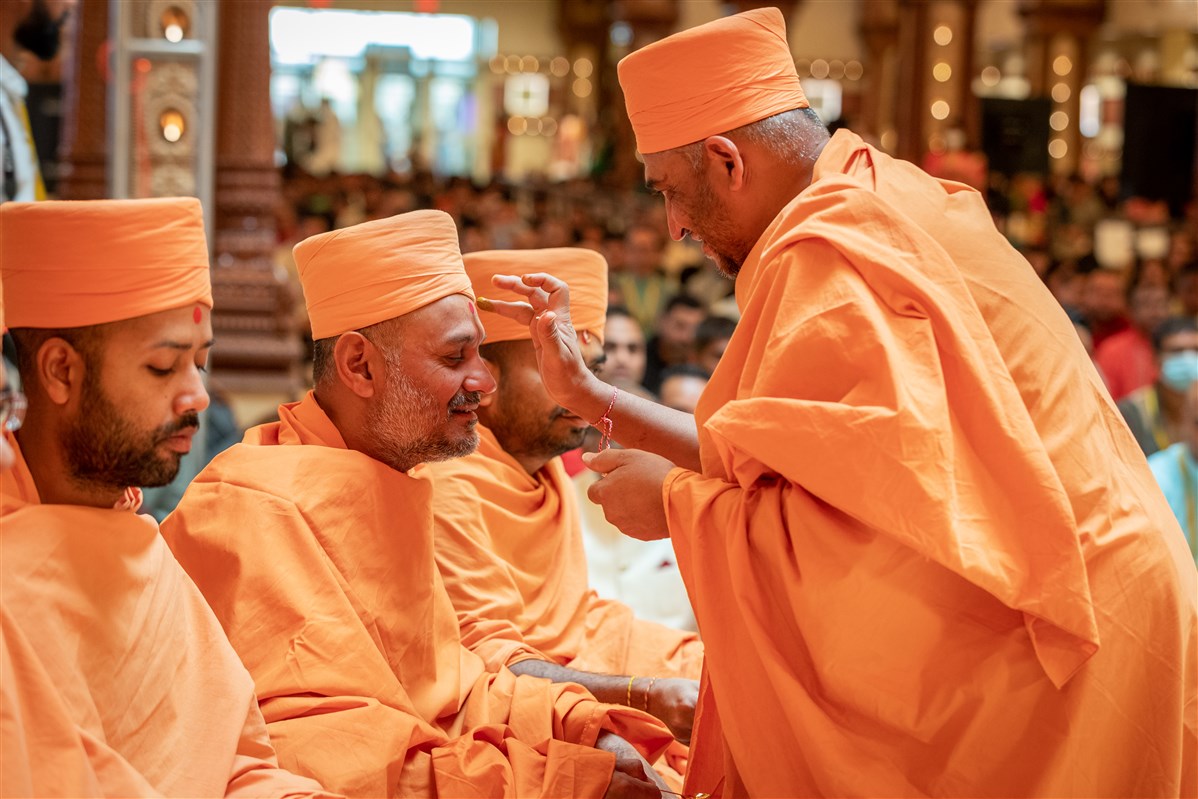 Swamis participate in the Chopda Pujan.