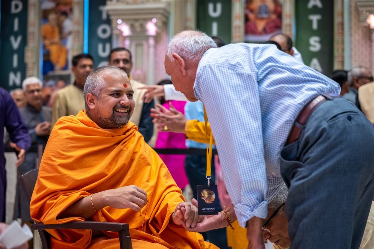 Pujya Nilkanthseva Swami joyously blesses a devotee on the Hindu New Year day.
