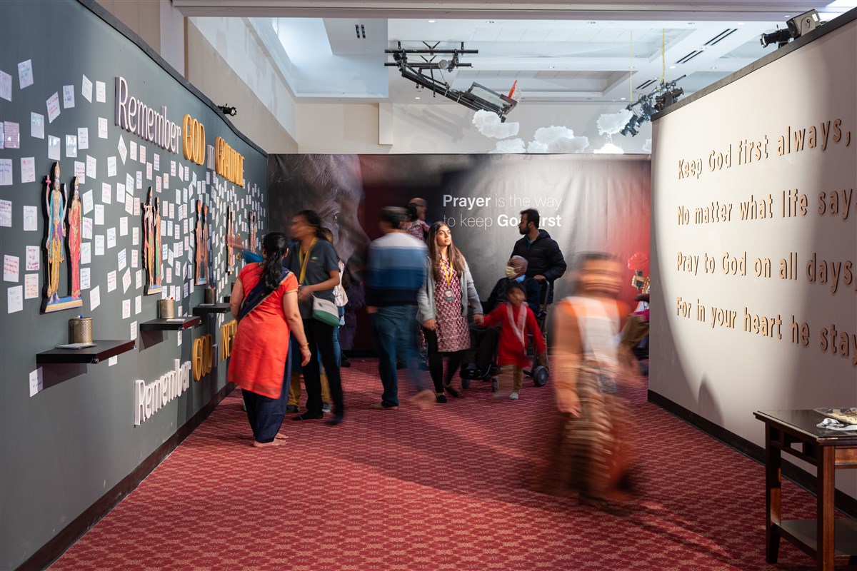 The Century of Service exhibition buzzing with visitors as they make their way through reading and being inspired by the life of Pramukh Swami Maharaj.