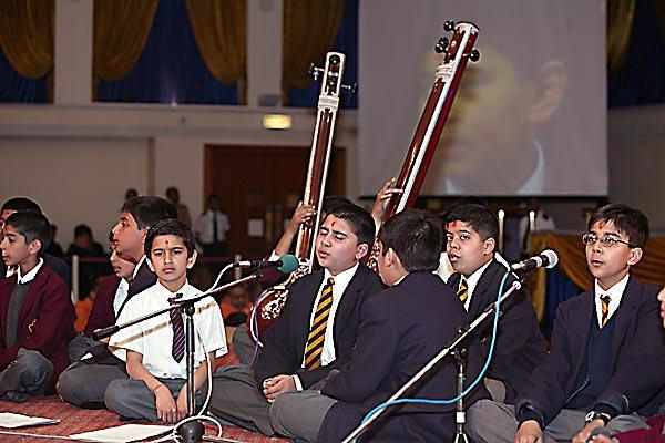 Students play and sing with great devotion and proficiency
