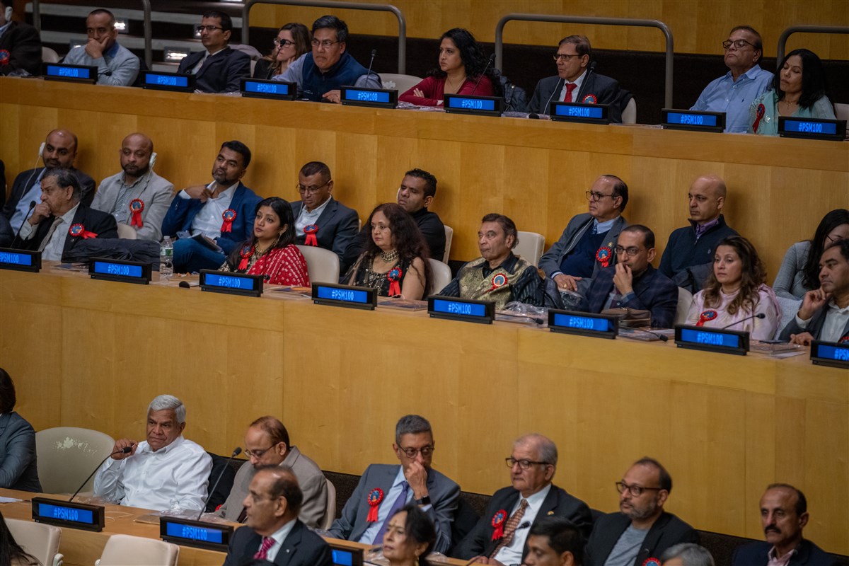 Delegates from various countries listen in to the program