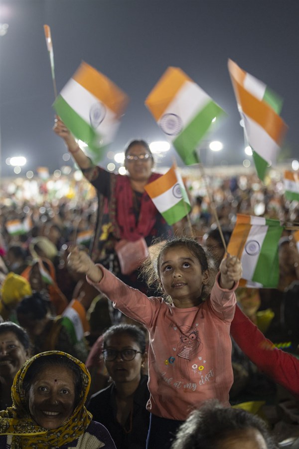 Devotees wave the Indian tricolor