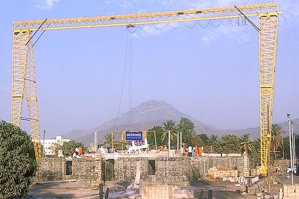 A view of the ongoing construction of a grand BAPS shikharbaddh mandir in the shadow of Siddhachal (Mt. Girnar)