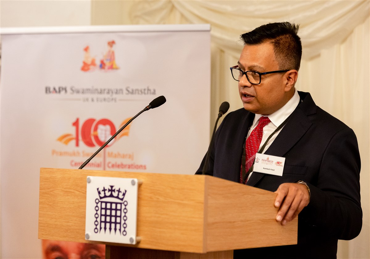 Kamlesh Patel, a BAPS volunteer, read a testimonial from British Airways, one of BAPS’s longstanding partners