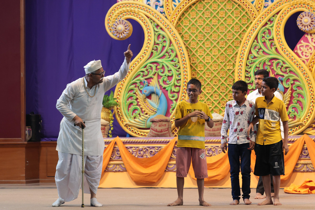 A skit presentation by children and a devotee