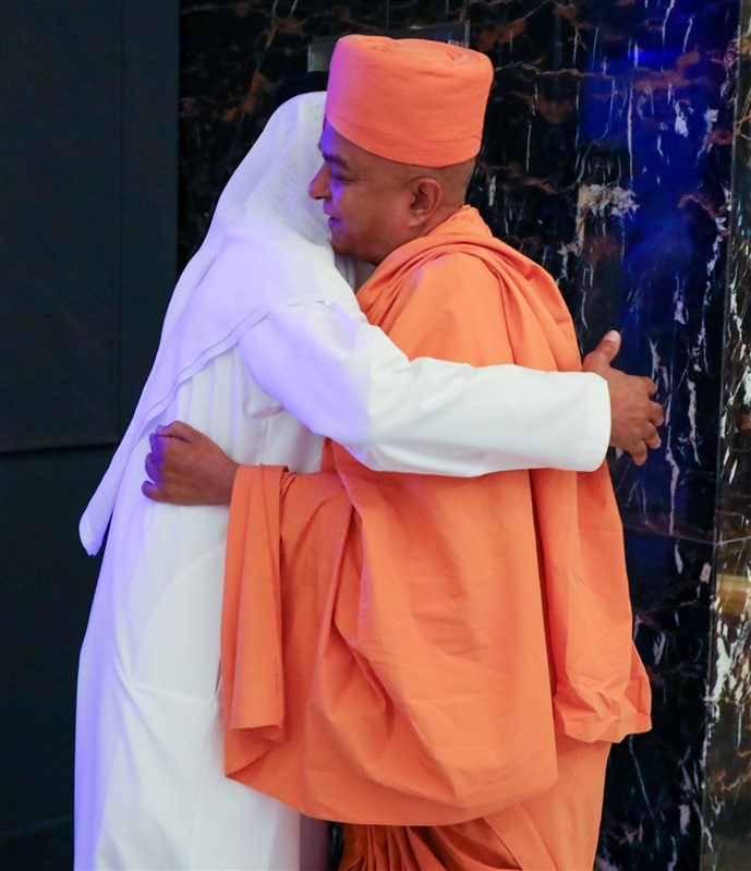 HE Sheikh Nahyan Mubarak Al Nahyan and Swami Brahmaviharidas stand together in a heartwarming embrace, symbolizing their deep love and shared vision for a vibrant and inclusive UAE