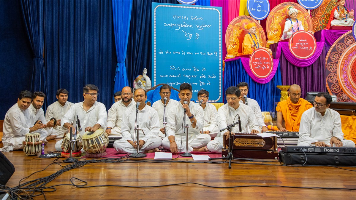 Youths sing kirtans in the volunteers' felicitation assembly in the evening