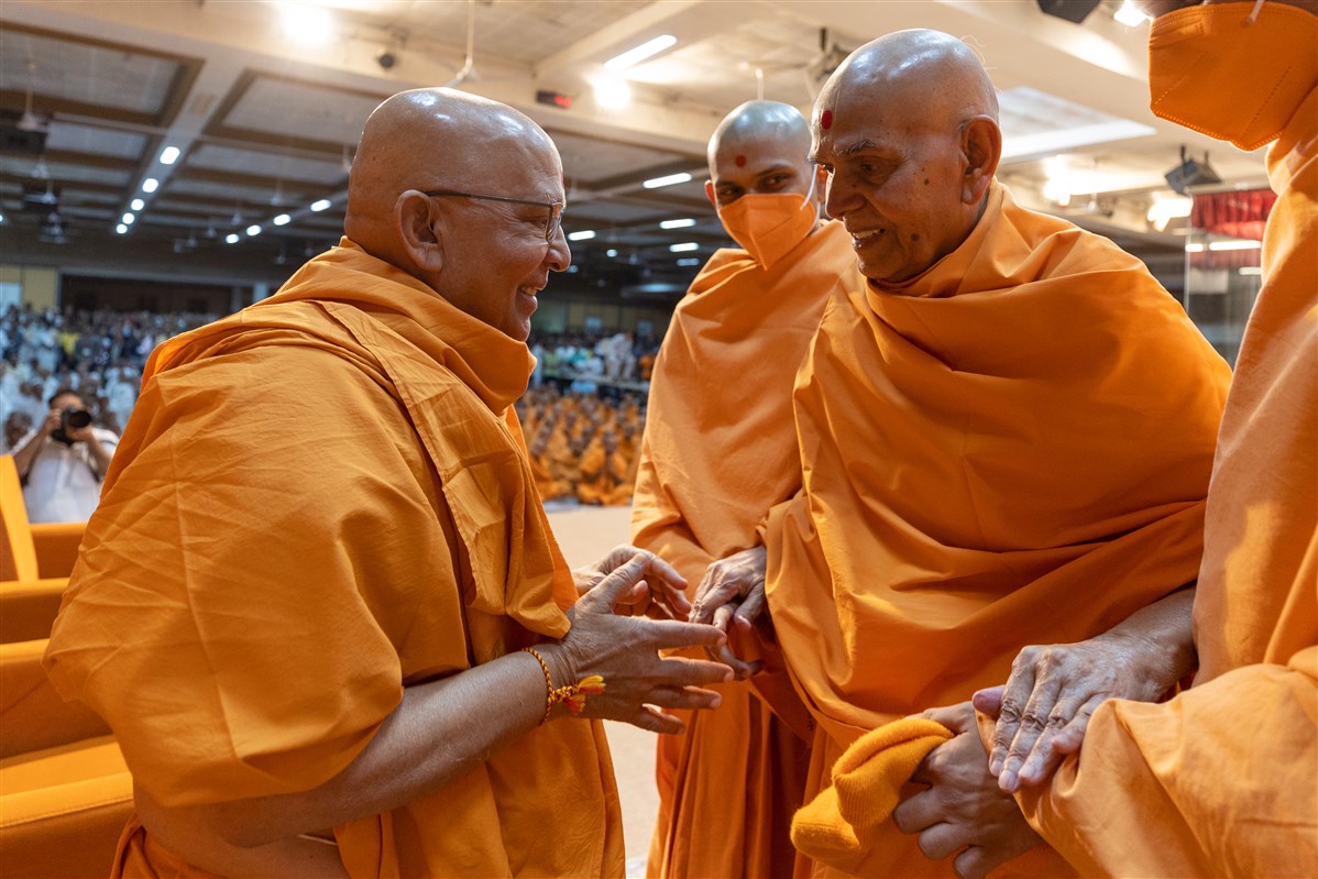Swamishri greets Pujya Ghanshyamcharan Swami