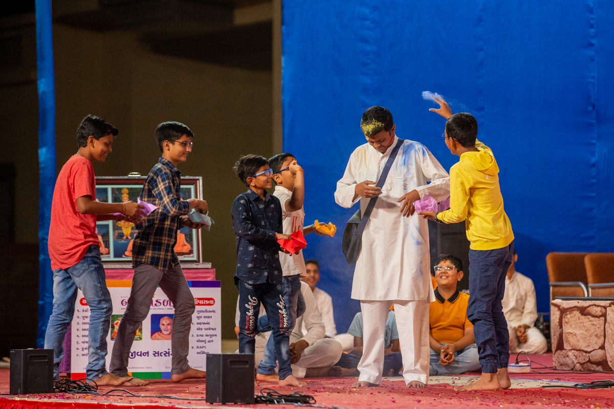 Children and youths perform a skit