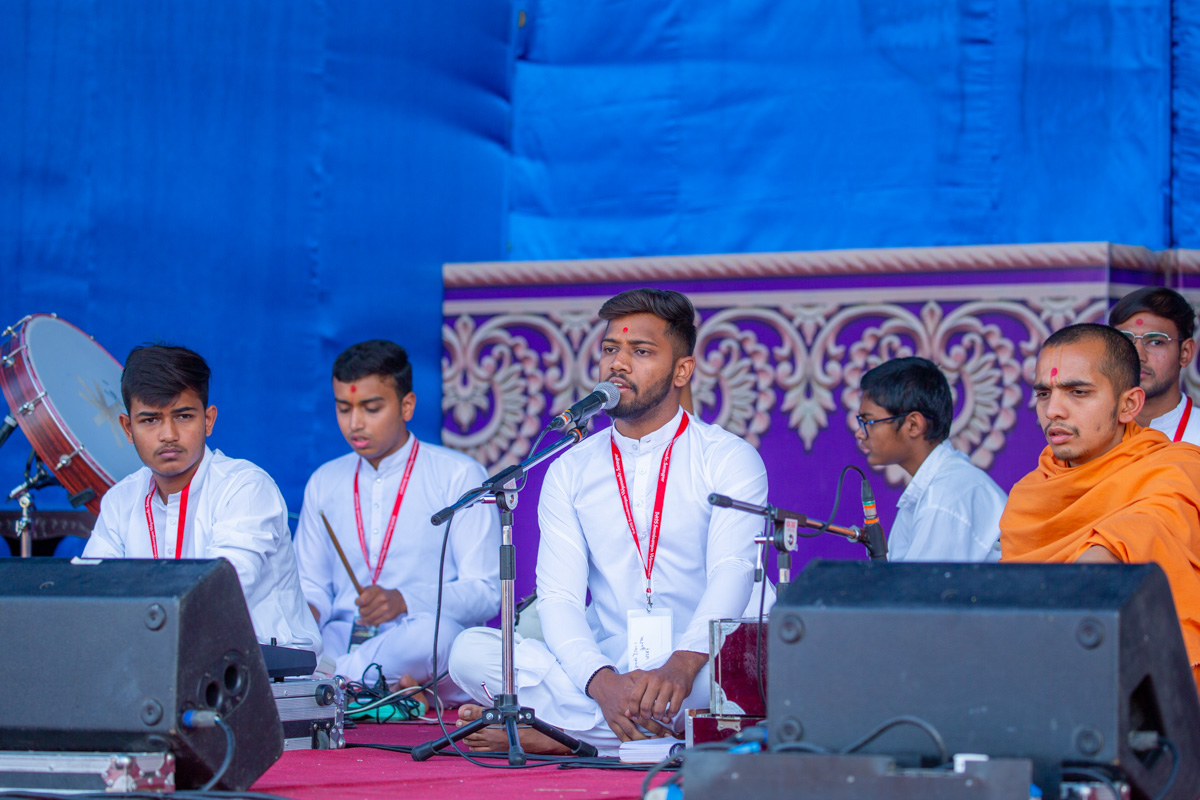 Former students of BAPS Swaminarayan Vidyamandir, Sarangpur, sing kirtans at the start of the evening assembly celebrating the 20th anniversary of the Vidyamandir