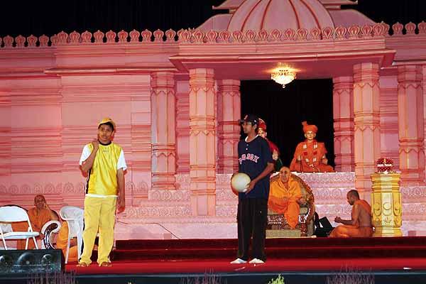 Devotees perform a drama on Parents' Day 