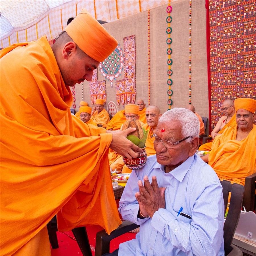 Sadhus and devotees participate in the mahapuja rituals