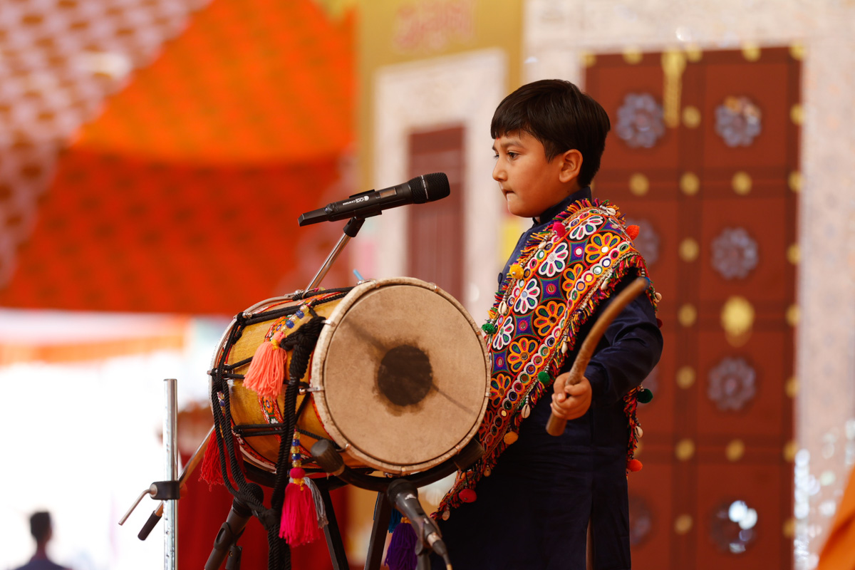 A child plays the dhol