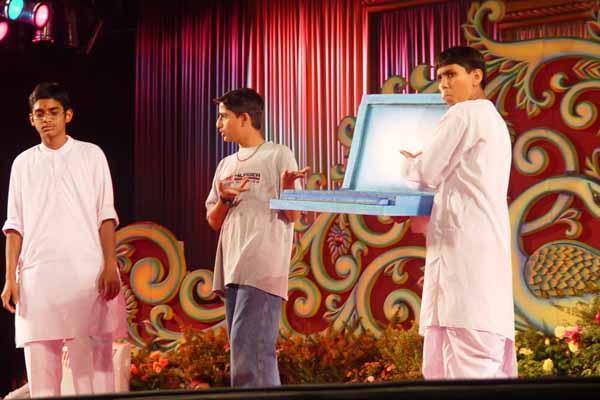 Children perform a drama on using the internet properly